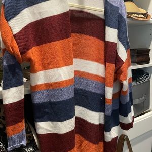 Multi-colored mid length cardigan. This is  pre owned worn by me Size medium.